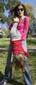 mother holding child upside down